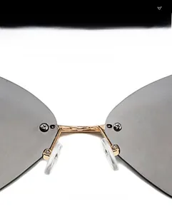 Detailed macro view of the golden metal bridge and soft silicone nose pads on these sunglasses