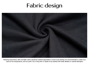 Macro shot of dark grey soft fabric texture with English washing care instructions