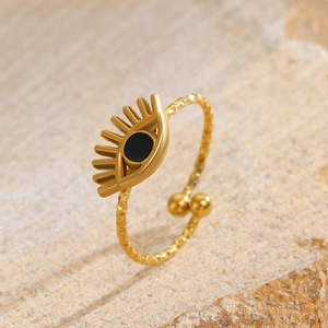 Detailed view of evil eye open ring with hammer texture finish and black inlay