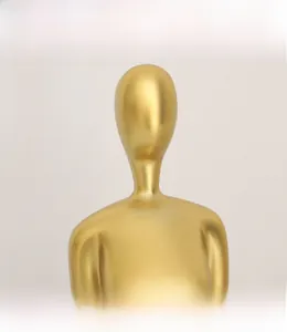 Close-up of golden abstract sculpture showing brushed metal texture and modern details