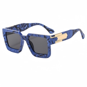 Square oversized sunglasses with blue marble frame and gold metal hinges on white background