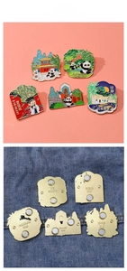 Detail of Chengdu panda and landmark metal magnets showing front enamel and back magnets