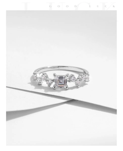 Detail of s925 silver ring featuring a square crystal and asymmetrical cluster setting