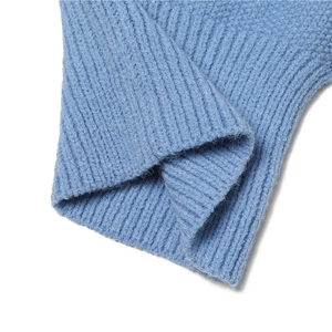 Detail of blue ribbed knit texture and soft warm wool material on a winter hooded scarf