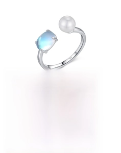 Detailed macro view of S925 silver ring featuring a white pearl and light blue gemstone