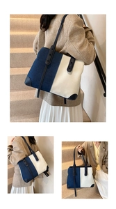 Detail view of denim and canvas tote bag featuring contrast stitching and leather straps