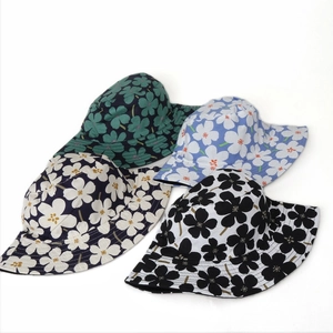 Women's reversible floral cotton bucket hats for summer sun protection in four color patterns