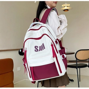 Retro two-tone canvas backpack in burgundy and white with SJM logo for students