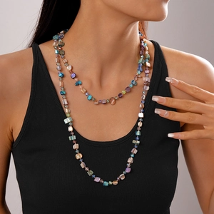 Bohemian multilayer beaded necklace with irregular colorful faux shell stones on a model