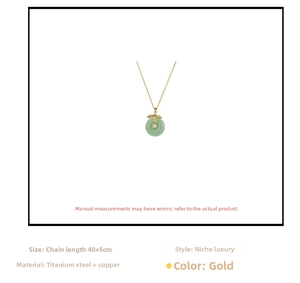 Detailed view of a green jade-like pendant necklace with gold titanium steel chain