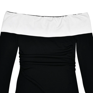 Close-up of black and white color-block off-shoulder dress with elegant ruched texture