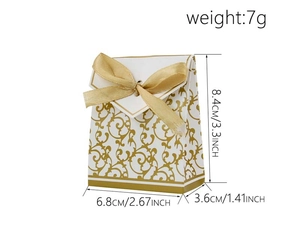 Detail showing white and gold pattern candy box with satin ribbon and dimensions
