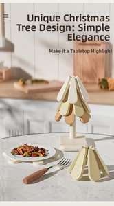 Detail of Christmas tree silicone trivet set featuring stackable heat resistant leaves