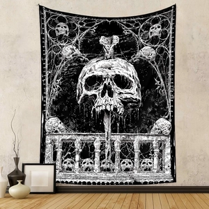 Detail of gothic black and white skull tapestry hanging on a minimalist room wall
