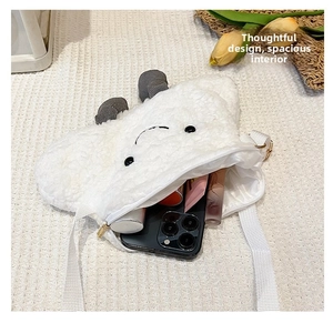 Top view of fluffy cloud sheep crossbody bag showing spacious interior for phone and makeup