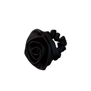 Elegant black satin rose hair scrunchie with a three-dimensional floral design