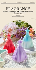Detailed view of handmade gown-shaped scented candles with intricate dress pleats