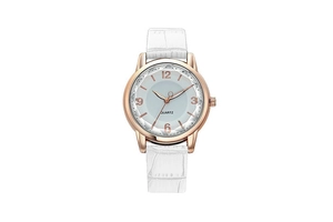 Detail of rose gold quartz watch with blue sunray dial and white crocodile leather strap