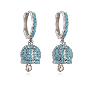 Detail of silver bell earrings with blue crystals and sparkling pavé setting