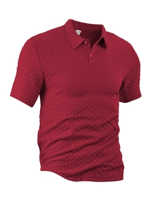 Macro detail of wine red polo shirt fabric featuring a distinct jacquard herringbone texture