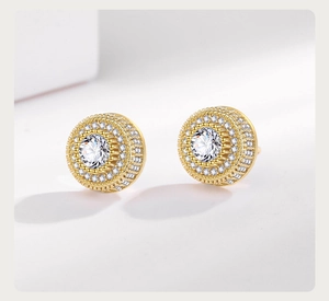 Macro shot of gold-plated hip hop stud earrings with double row micro-pave cubic zirconia