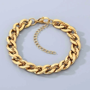 Close-up of golden double-layer Cuban link bracelet with adjustable lobster clasp