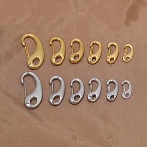 Golden and silver stainless steel lobster claw clasps in six sizes on brown silk