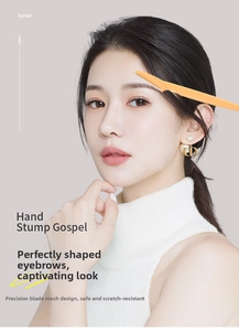 Macro safety net on orange eyebrow razor blade for precise and safe facial grooming