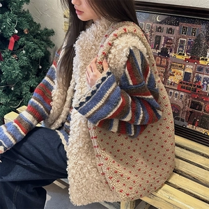 Winter lifestyle scene featuring a plush shearling tote bag with red heart pattern detail