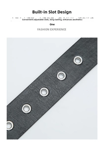 Detail of punk style black leather belt with silver pyramid studs and metal eyelets