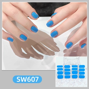 Detail of SW607 blue solid color nail wraps with glossy finish shown on model hands