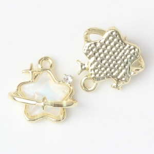 Detail view of golden star charm with iridescent opal effect and tiny inset crystal