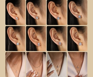 Detail of luxury oval zircon earrings and layered necklaces in sterling silver finish