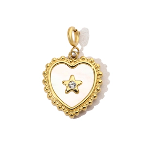 Macro shot of gold heart pendant with white shell inlay, star detail and zircon crystal