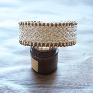 Detailed view of handmade raffia headband texture with retro woven raffia and edge wrap