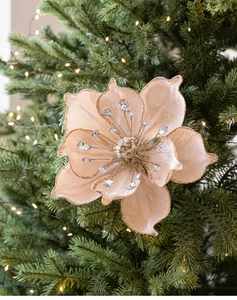 Macro detail of champagne velvet magnolia with gold glitter edges and rhinestone center