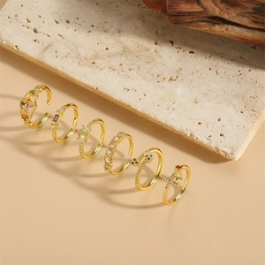 Set of five gold-plated open rings with colorful zircon inlays and vintage cross designs