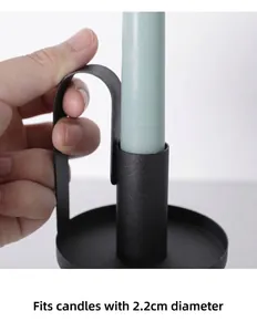 Detail view of black metal candle holder with ergonomic handle and 2.2cm socket