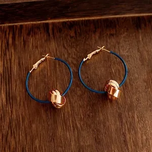 18K gold plated intertwined geometric knot hoop earrings with deep blue circle accents