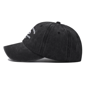 Washed black cotton baseball cap with side Forever embroidery and curved brim in side view