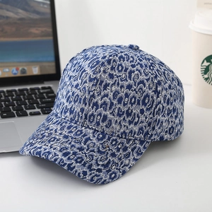 Detail of blue and white jacquard pattern on a six-panel wide brim baseball cap