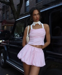 Detail of pink halter top with white collar and matching puff balloon skirt outfit