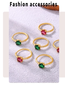 Macro shot of 3-carat red and green oval gemstone rings with side diamond accents