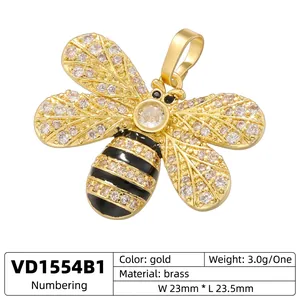 Gold bee pendant in brass with sparkling cubic zirconia and black enamel stripes