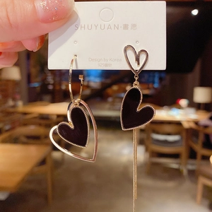 Detail of asymmetric heart tassel earrings with gold frames and S925 silver posts