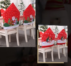 Detailed view of red Christmas hat chair covers with Santa Claus and snowman prints