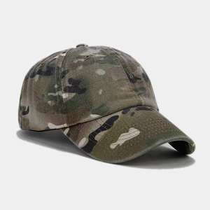 Close-up of camouflage baseball cap showing twill cotton texture and curved brim detail