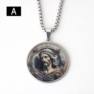 Macro shot of silver stainless steel pendant featuring vintage Jesus painting and box chain