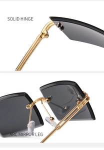 Detail of solid hinge and arc mirror leg on rimless square sunglasses with gold metal frame
