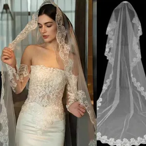 Long ivory bridal veil with elegant floral lace embroidery and soft tulle layering